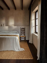 Armadillo Mason Rug in Yolk, a second view of the handwoven new zealand wool rug in a styled interior