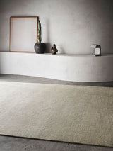 Armadillo Corsica Rug in Saltbush, handwoven wool and linen rug shown in a room setting