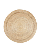 Armadillo Petunia Rug in Natural, a second view of the hand-braided jute rug in a styled interior