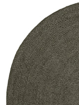Armadillo Braid Rug in Ivy, corner close-up of the wool and viscose blend pile and edge