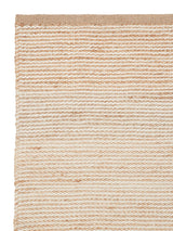 Armadillo Drift Rug in Natural & White, corner close-up of the jute and wool pile and edge