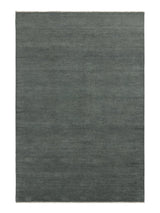 Armadillo Thatch Rug in Orca, a second view of the hand-knotted wool rug in a styled interior