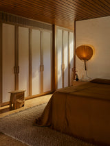 Armadillo Arroyo Rug in Sepia, handwoven felted wool rug shown in a room setting