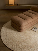 Armadillo Onsen Rug in Papyrus, a second view of the hand-braided wool and jute rug in a styled interior