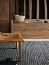 Armadillo Cable Rug in Chambray, a second view of the handwoven soumak wool rug in a styled interior