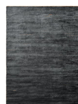 Armadillo Staccato Rug in Nightfall, corner close-up of the silk, linen, and cotton pile and edge