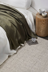 Armadillo Winnow Rug in Alabaster, handwoven wool flatweave rug shown in a room setting