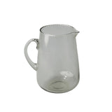 Be Home clear glass pitcher with a delicate ruffled rim and curved handle for elegant beverage serving