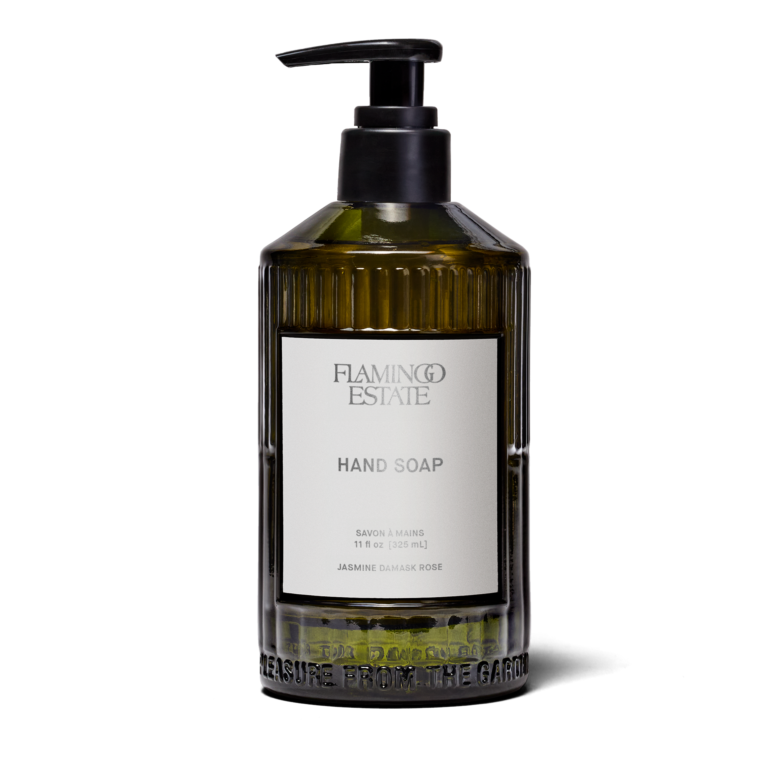 A fluted forest-green glass bottle of Flamingo Estate Jasmine Damask Rose Hand Soap with a brushed-metal pump dispenser, photographed centered on a clean white background.