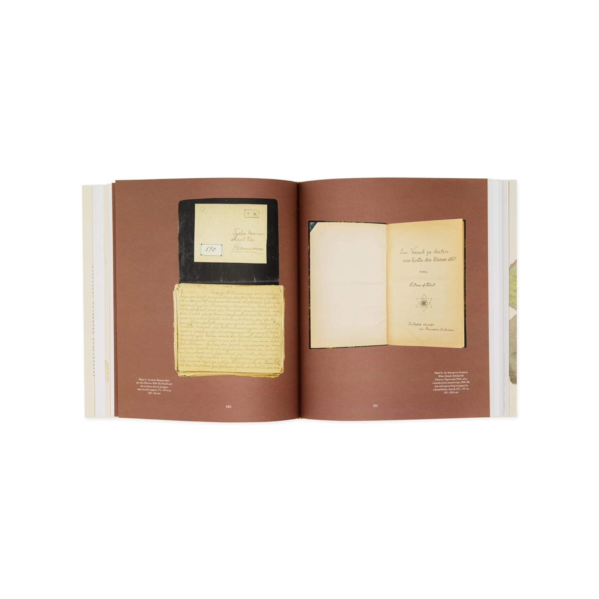 Open book with yellowed pages on a white background