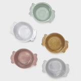 Il Buco Assisi ceramic bowls with side handles in assorted pastel colours including dove grey, pink, and ochre.