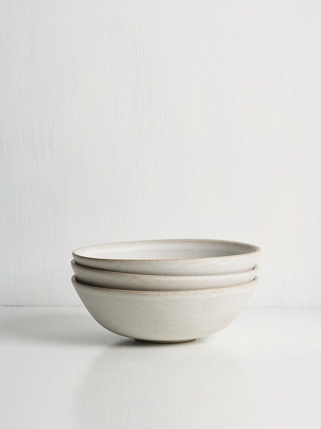 Small bowl side view showing curved silhouette and glaze detail