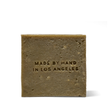 Back of the Flamingo Estate Rosemary & Parsley Soap Brick, embossed Made by Hand in Los Angeles.