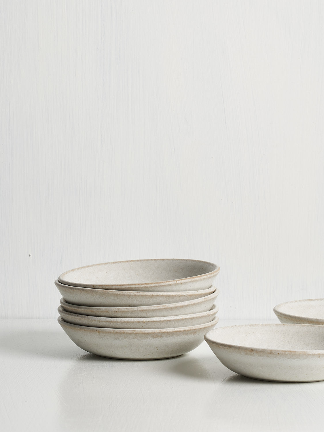 Standard Affair Snack Bowl in oat glaze, side view