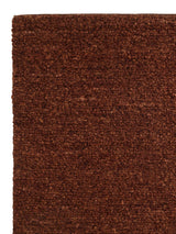 Armadillo Mason Rug in Sangria, corner close-up of the new zealand wool pile and edge