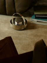Armadillo Lathe Rug in Doe, a second view of the hand-knotted jute rug in a styled interior