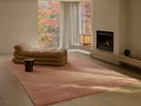 Armadillo Agra Rug in Salmon, overhead view of the hand-knotted wool weave and edge finish