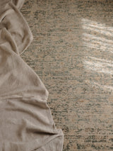 Armadillo Minuet Rug in Skylark, a second view of the hand-knotted clipped wool rug in a styled interior