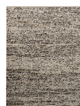 Armadillo Faroe Rug in Muscovado, corner close-up of the undyed european wool pile and edge