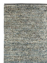 Armadillo Acacia Rug in Galapagos, corner close-up of the wool and abrash-dyed jute pile and edge