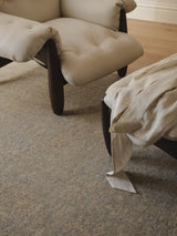 Armadillo Adagio Rug in Neptune, a second view of the hand-knotted wool rug in a styled interior