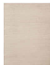 Armadillo Aerie Rug in Coconut, corner close-up of the linen, wool, and jute pile and edge
