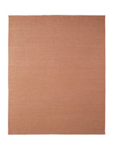 Armadillo Aerie Rug in Bellini, a second view of the handwoven flatweave rug in a styled interior