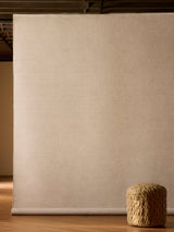 Armadillo Aerie Rug in Coconut, handwoven flatweave rug shown in a room setting