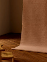 Armadillo Aerie Rug in Bellini, handwoven flatweave rug shown in a room setting