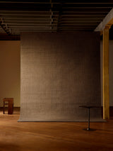 Armadillo Palloza Rug in Shale, handwoven jute flatweave rug shown in a room setting