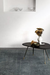 Armadillo Agra Rug in Marlin, a second view of the hand-knotted wool rug in a styled interior