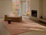 Armadillo Agra Rug in Salmon, overhead view of the hand-knotted wool weave and edge finish