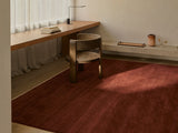 Armadillo Agra Rug in Burnt Umber, overhead view of the hand-knotted wool weave and edge finish
