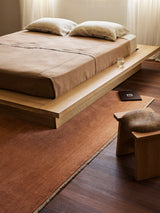 Armadillo Agra Rug in Salmon, a second view of the hand-knotted wool rug in a styled interior