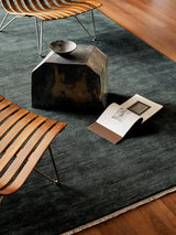Armadillo Agra Rug in Juniper, hand-knotted wool rug shown in a room setting
