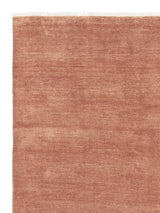 Armadillo Agra Rug in Salmon, corner close-up of the wool pile and edge