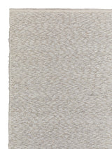 Armadillo Andes Rug in Parchment, corner close-up of the wool pile and edge