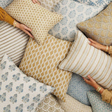 Walter G Aravelli Saffron pillow with Mughal-inspired arch patterns, hand-block printed with piped edges.