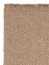 Armadillo Arroyo Rug in Sepia, corner close-up of the felted wool pile and edge