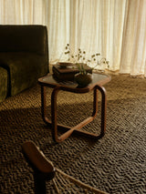 Armadillo Arroyo Rug in Thorn, a second view of the handwoven felted wool rug in a styled interior