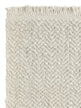 Armadillo Arroyo Rug in Chalk, corner close-up of the felted wool pile and edge