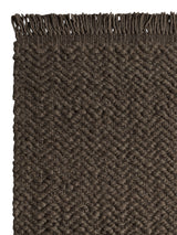 Armadillo Arroyo Rug in Thorn, corner close-up of the felted wool pile and edge