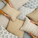 Walter G Ashfa Elm pillow with intricate tan floral pattern, piped edges, and a hidden zipper closure.