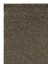 Armadillo Aspen Rug in Hawthorn, corner close-up of the undyed wool pile and edge