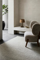 Armadillo Aspen Rug in Fog, a second view of the handwoven soumak wool rug in a styled interior