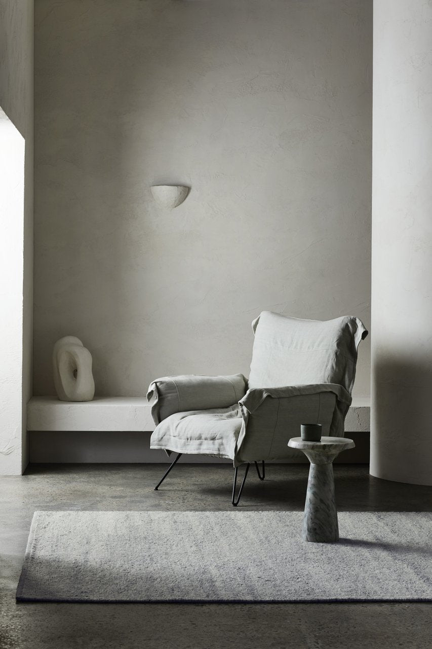 Aspen Rug by Armadillo, handwoven soumak wool rug, styled in a room at Calimia Home