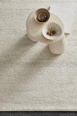 Armadillo Aspen Rug in Natural, a second view of the handwoven soumak wool rug in a styled interior