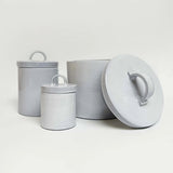 White Italian ceramic canister styled on a kitchen shelf
