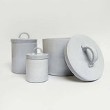 White Italian ceramic canister styled on a kitchen shelf