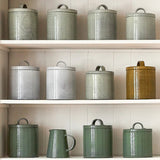 Dove grey Italian ceramic canister styled on a kitchen shelf